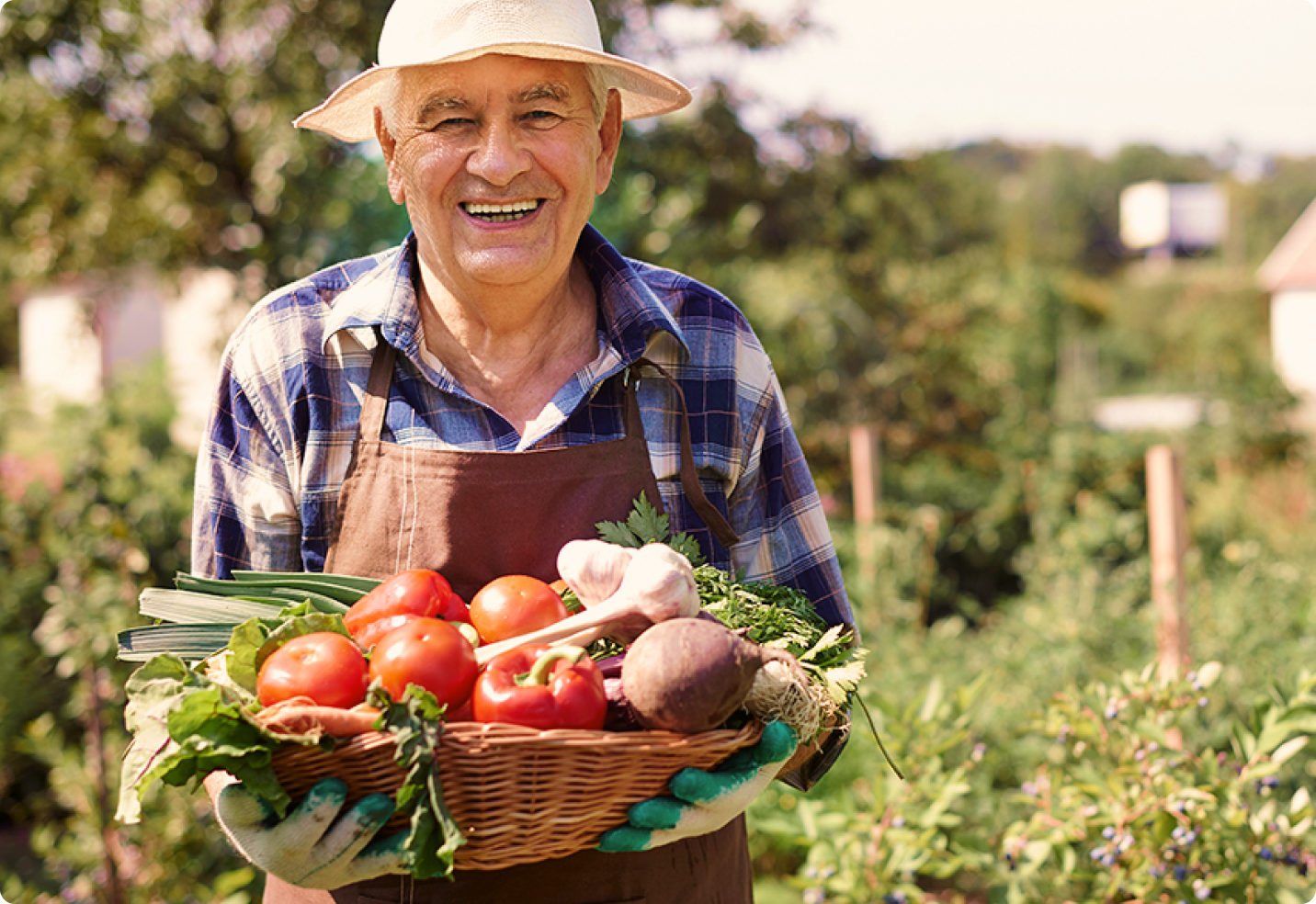 man holding basket of organic produce